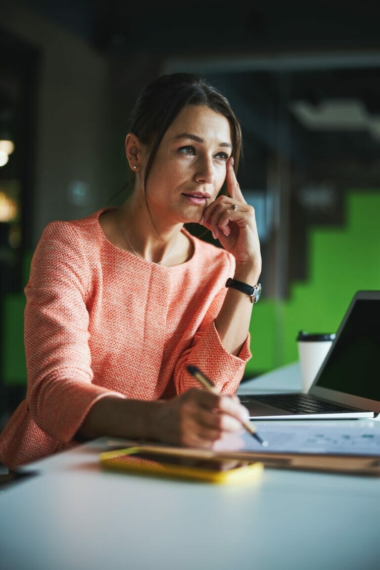 Charming attractive business woman concerned making difficult decision and lost in thought